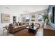 Comfortable living room featuring neutral tones, modern decor, and lots of natural light at 8519 W Clemente Way, Florence, AZ 85132