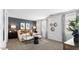 Cozy primary bedroom with stylish decor, a statement wall, and soft carpeting at 8519 W Clemente Way, Florence, AZ 85132