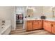 Bright bathroom featuring a double sink vanity, soaking tub, and walk-in closet with ample storage at 9566 N 83Rd Dr, Peoria, AZ 85345