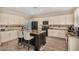 Kitchen with island and seating, stainless steel appliances, granite counters, and tile backsplash at 9566 N 83Rd Dr, Peoria, AZ 85345