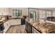 Kitchen with island and seating, stainless steel appliances, granite counters, and tile backsplash at 9566 N 83Rd Dr, Peoria, AZ 85345