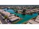 Beautiful aerial view of waterfront homes with solar panels and calm blue waters at 10387 W Runion Dr, Peoria, AZ 85382