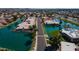Overhead view of waterfront homes on a tranquil lake with beautiful landscaping and clear blue waters at 10387 W Runion Dr, Peoria, AZ 85382