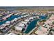 Aerial view of waterfront homes with tranquil blue waters and community with solar panels at 10387 W Runion Dr, Peoria, AZ 85382