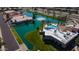 Aerial shot of waterfront homes with backyard pools, lush grass and tranquil blue waters at 10387 W Runion Dr, Peoria, AZ 85382