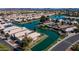Expansive aerial view of waterfront homes with solar panels near tranquil blue waters at 10387 W Runion Dr, Peoria, AZ 85382
