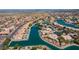 Waterfront community houses aerial, solar panels, lush yards, and inviting waterfront appeal at 10387 W Runion Dr, Peoria, AZ 85382