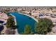 An aerial view showcasing backyard water access on a sunny day in a quiet community at 10387 W Runion Dr, Peoria, AZ 85382