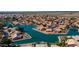 A beautiful view of a waterfront community with tree-lined streets, water access, and well-kept homes at 10387 W Runion Dr, Peoria, AZ 85382