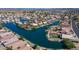 Overhead view of homes in a waterfront community, highlighting landscaping and waterway access at 10387 W Runion Dr, Peoria, AZ 85382