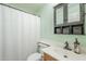 Guest bathroom featuring a shower with white shower curtain and tiled flooring, with a decorative cabinet at 10387 W Runion Dr, Peoria, AZ 85382