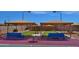 Covered bocce ball courts and seating, create a social space for outdoor activities at 10387 W Runion Dr, Peoria, AZ 85382