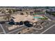 Aerial view of the community clubhouse featuring a swimming pool and well-maintained grounds at 10387 W Runion Dr, Peoria, AZ 85382