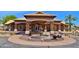 Inviting clubhouse entrance with a charming fountain, enhancing the community's welcoming appeal at 10387 W Runion Dr, Peoria, AZ 85382