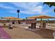 Horseshoe pit with seating under sunshades to promote outdoor activities for the community at 10387 W Runion Dr, Peoria, AZ 85382