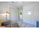 Comfortable living room featuring wood-look floors and natural light at 10387 W Runion Dr, Peoria, AZ 85382