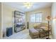 Cozy living room featuring chair with ottoman, book shelf and speaker at 10387 W Runion Dr, Peoria, AZ 85382