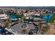 Aerial view of community parking area along the lake with lush landscaping, and the American flag prominently displayed at 10387 W Runion Dr, Peoria, AZ 85382