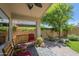 Relaxing covered patio with seating area and view of landscaped backyard at 10387 W Runion Dr, Peoria, AZ 85382