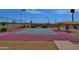 Bright and well-maintained community pickleball court with seating and covered areas at 10387 W Runion Dr, Peoria, AZ 85382