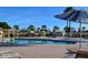 Sparkling pool area with lounge chairs, inviting residents to relax and soak up the sun in style at 10387 W Runion Dr, Peoria, AZ 85382