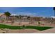 Fenced community pool area with seating, umbrellas, and landscaping for a serene outdoor experience at 10387 W Runion Dr, Peoria, AZ 85382