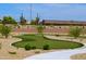 A mini putting green with well-maintained landscaping, offering a fun outdoor activity at 10387 W Runion Dr, Peoria, AZ 85382