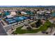 Aerial view showcasing community tennis courts, park area and other recreation area with lake and community in background at 10387 W Runion Dr, Peoria, AZ 85382