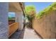 Home exterior featuring a private side yard with mature foliage at 10387 W Runion Dr, Peoria, AZ 85382