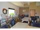 Well-lit workshop area with tables, chairs, storage, and kilns provides a creative space for residents at 10387 W Runion Dr, Peoria, AZ 85382