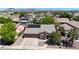 Stunning aerial view of a home showcasing its well-manicured landscaping and attached three car garage at 10504 E Diamond Ave, Mesa, AZ 85208