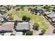 Aerial view of a home near a large grassy park area and greenbelt at 10504 E Diamond Ave, Mesa, AZ 85208