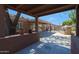 Charming backyard patio with an outdoor fireplace, perfect for relaxing evenings and entertaining guests at 10504 E Diamond Ave, Mesa, AZ 85208
