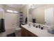 Well-lit bathroom with a single sink vanity and a shower-tub combination at 10504 E Diamond Ave, Mesa, AZ 85208