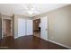 Bedroom with wood floors, a ceiling fan, and ample closet space at 10504 E Diamond Ave, Mesa, AZ 85208