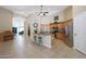 Spacious kitchen with granite countertops, stainless steel appliances, and a center island with seating at 10504 E Diamond Ave, Mesa, AZ 85208