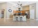 Well-lit kitchen features granite countertops, stainless steel appliances, and a center island with barstool seating at 10504 E Diamond Ave, Mesa, AZ 85208