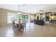 Open concept living space with tile flooring, built-in shelves, and plenty of natural light at 10504 E Diamond Ave, Mesa, AZ 85208