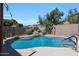 A refreshing pool with rock accents offers a peaceful retreat in the backyard at 10504 E Diamond Ave, Mesa, AZ 85208