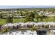 Aerial view of community featuring well-maintained homes and a green golf course at 1056 S 81St St, Mesa, AZ 85208