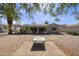 Spacious backyard featuring desert landscaping, a brick patio, and an enclosed patio at 1056 S 81St St, Mesa, AZ 85208