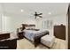 Comfortable bedroom featuring wood floors, neutral decor, and a ceiling fan at 1056 S 81St St, Mesa, AZ 85208