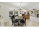 Cozy dining area with wood floors and views of the kitchen and outdoor space at 1056 S 81St St, Mesa, AZ 85208