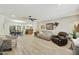 Bright and airy living room featuring neutral tones, a ceiling fan, and wood-look flooring at 1056 S 81St St, Mesa, AZ 85208