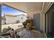 A covered patio with a table and chairs; great spot for outdoor relaxation and enjoyment at 1056 S 81St St, Mesa, AZ 85208