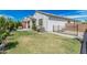This house has a well-maintained backyard and grass, along with a fence and desert landscaping at 14419 W El Cortez Pl, Surprise, AZ 85387