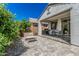 Charming backyard patio with pavers, perfect for outdoor dining and enjoying the serene garden view at 14419 W El Cortez Pl, Surprise, AZ 85387
