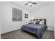 Comfortable bedroom with ceiling fan and natural light at 14419 W El Cortez Pl, Surprise, AZ 85387