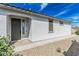 Attractive home exterior with a well-maintained landscape, a covered entryway, and a neutral color scheme at 14419 W El Cortez Pl, Surprise, AZ 85387