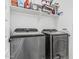 This is a laundry room featuring a modern washer and dryer with storage space at 14419 W El Cortez Pl, Surprise, AZ 85387